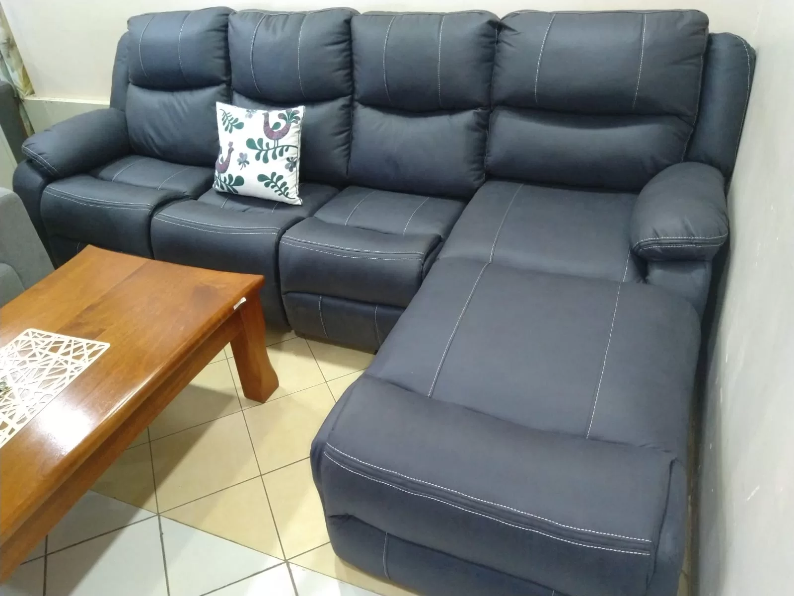 Miam dark grey L-shaped 6-seater sectional recliner.